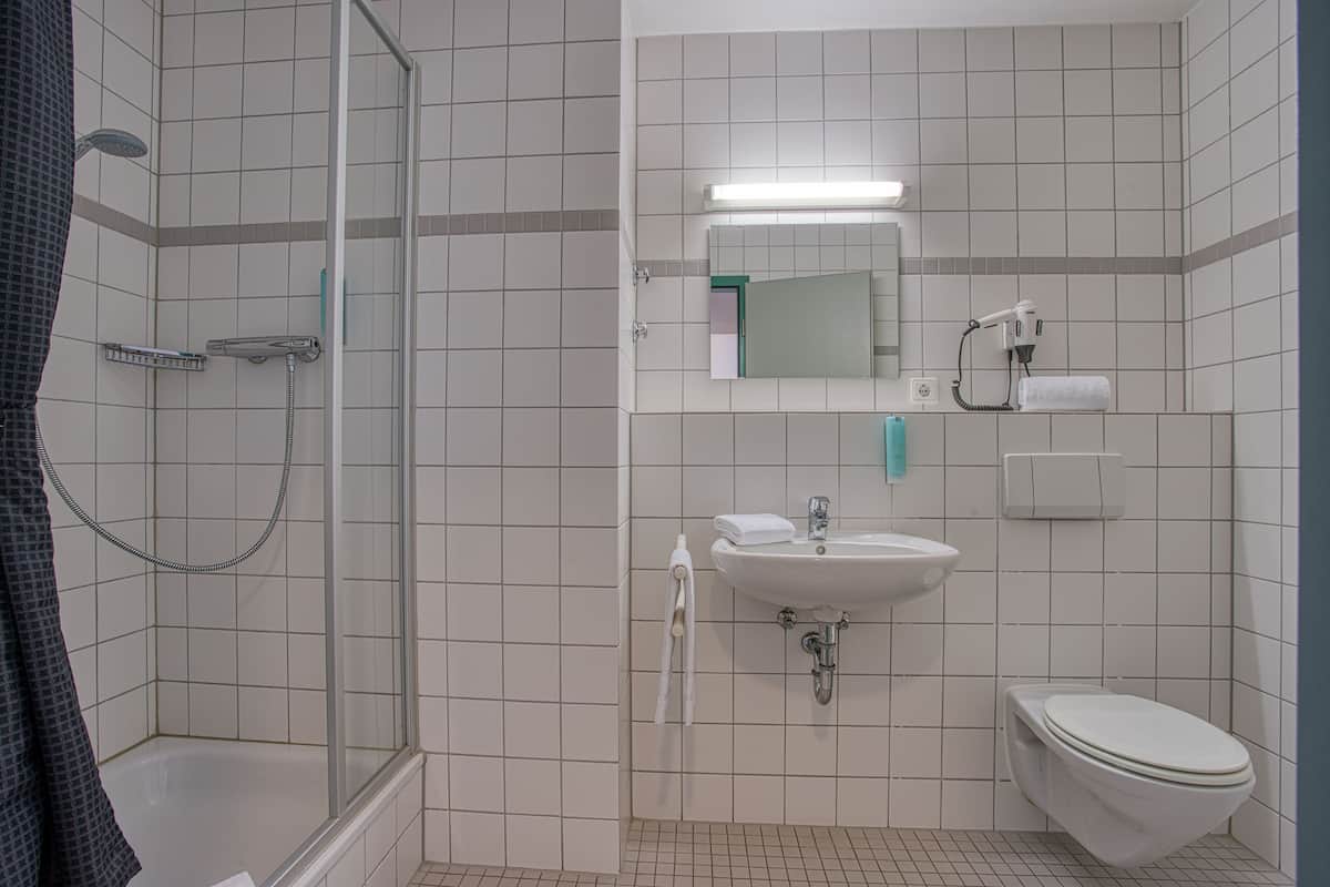 shower, rainfall showerhead, hair dryer, towels