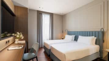 Premium bedding, down comforters, minibar, in-room safe