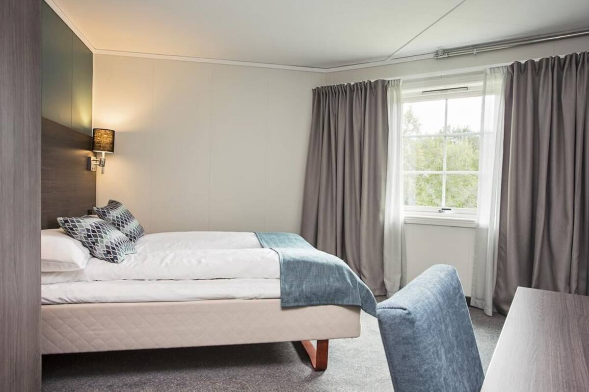 Premium bedding, pillow-top beds, desk, blackout curtains