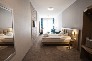 Apartment, 1 Bedroom | Minibar, in-room safe, iron/ironing board, free cribs/infant beds