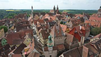 A historic town with traditional architecture, including half-timbered houses and a prominent church tower.