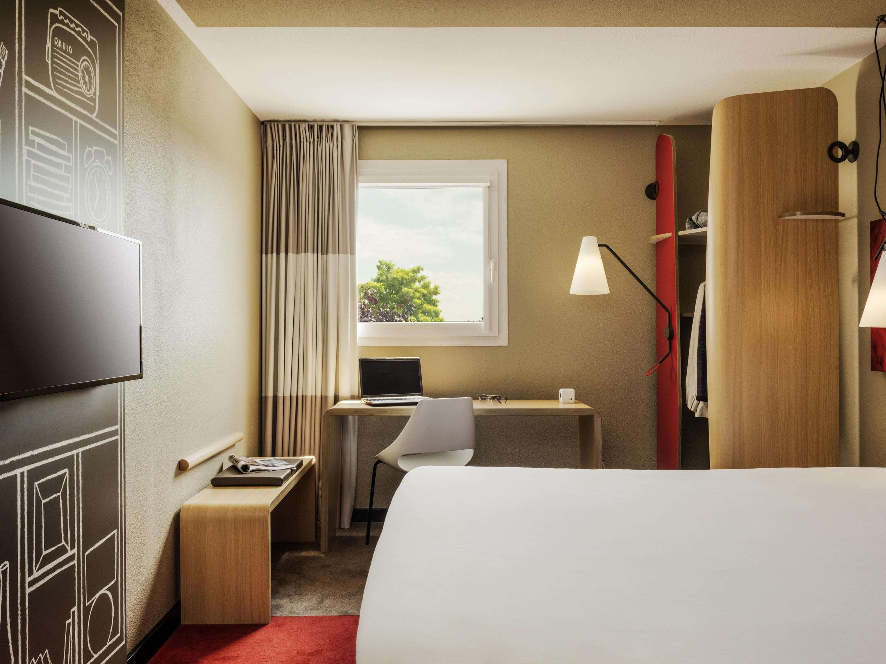 Premium bedding, desk, laptop workspace, blackout curtains