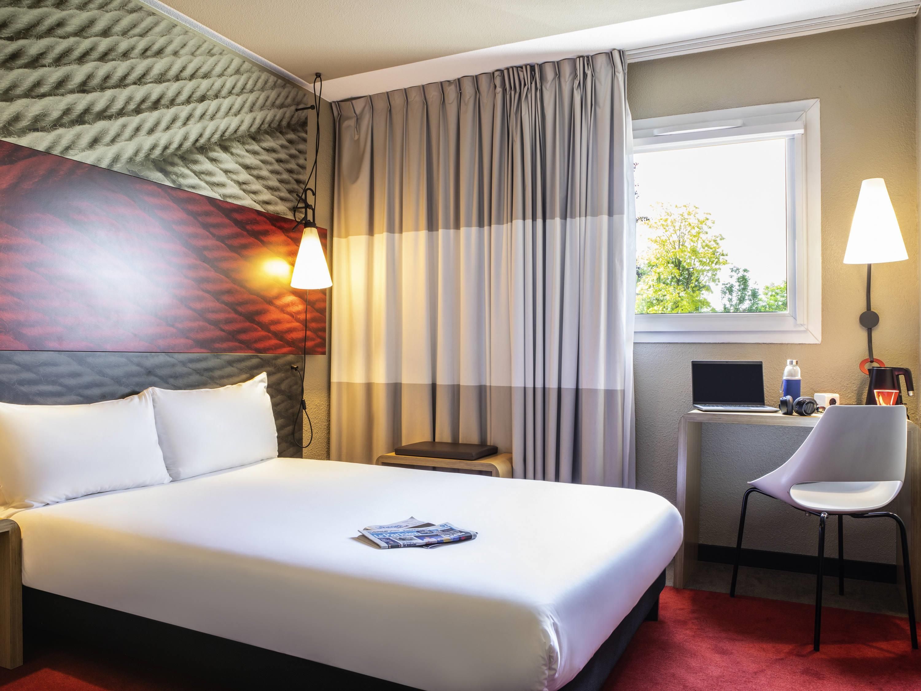 Premium bedding, desk, laptop workspace, blackout curtains