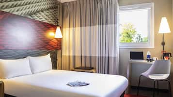 Premium bedding, desk, laptop workspace, blackout curtains