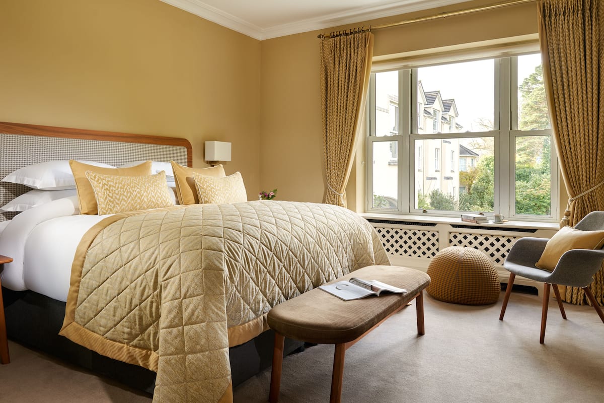 Signature Suite | Premium bedding, in-room safe, blackout drapes, iron/ironing board