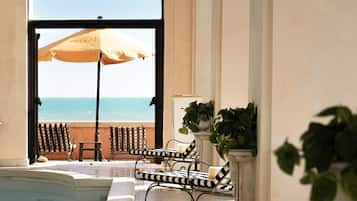 Indoor pool, pool umbrellas, sun loungers
