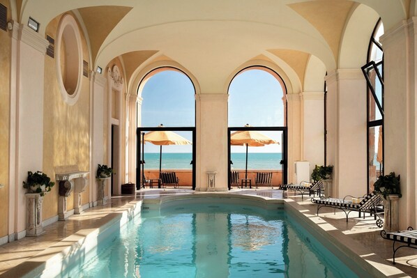 Indoor pool, pool umbrellas, sun loungers