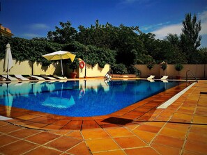 Seasonal outdoor pool, pool umbrellas, pool loungers