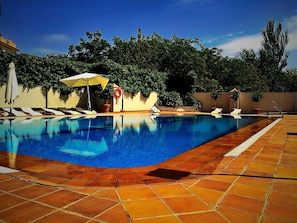 Seasonal outdoor pool, pool umbrellas, pool loungers
