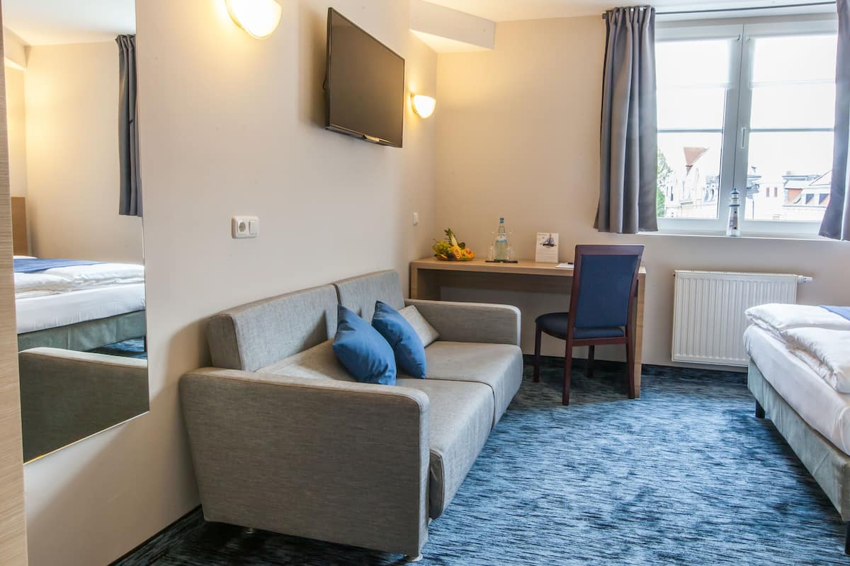 comfort double room | living area | flat-screen tv