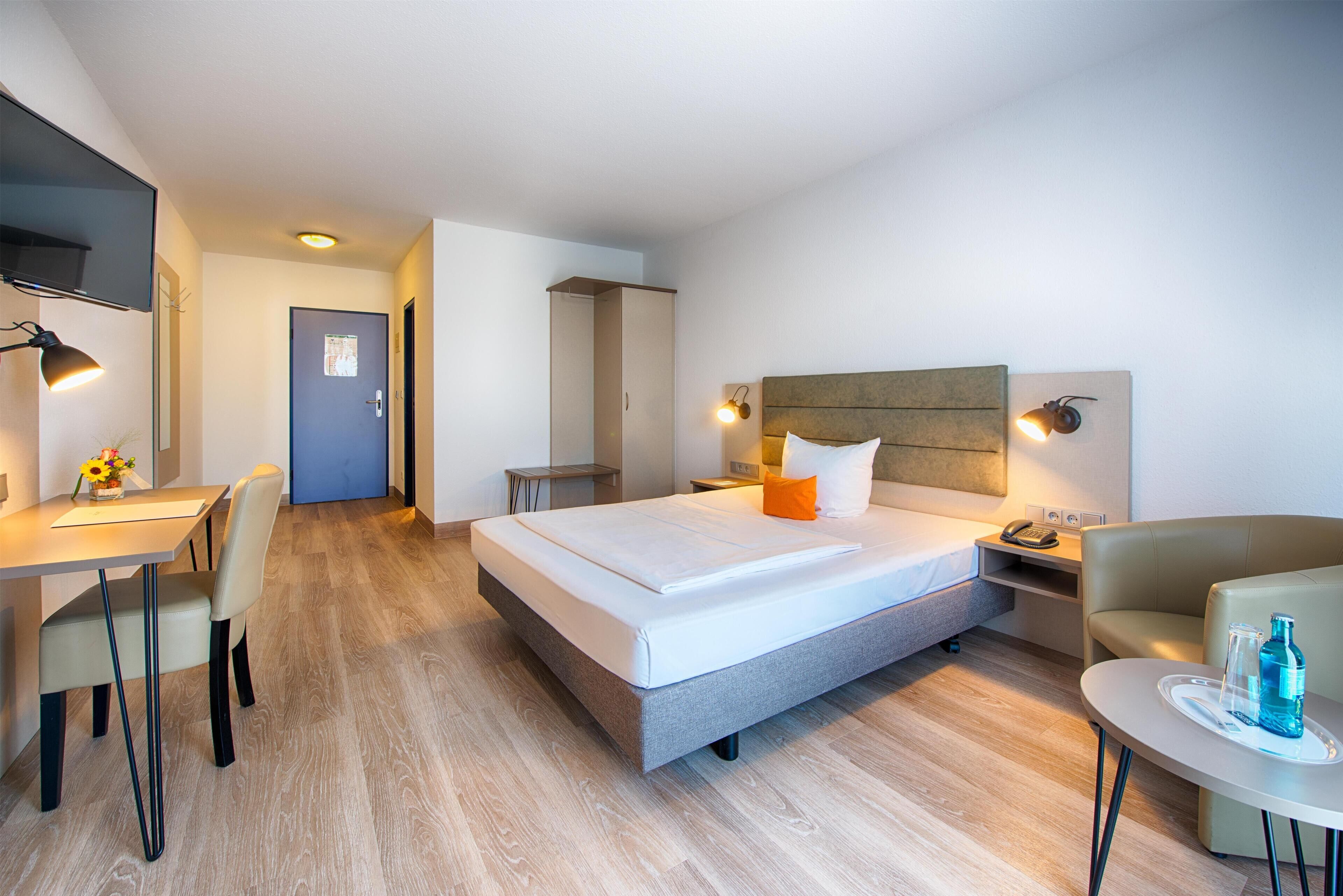 Hypo-allergenic bedding, desk, blackout drapes, soundproofing