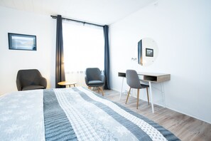 Standaard kamer | Woonkamer | Flatscreentelevisie