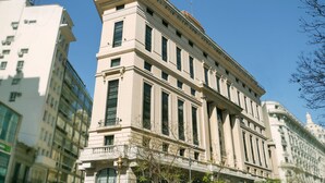 A multi-story building with classical architecture, featuring large windows and a prominent entrance. - 725 Continental (Buenos Aires)