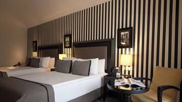 Family Room | 1 bedroom, premium bedding, minibar, in-room safe