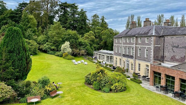A large building with a garden and outdoor seating area. - The Maryborough Hotel and Spa (Douglas)