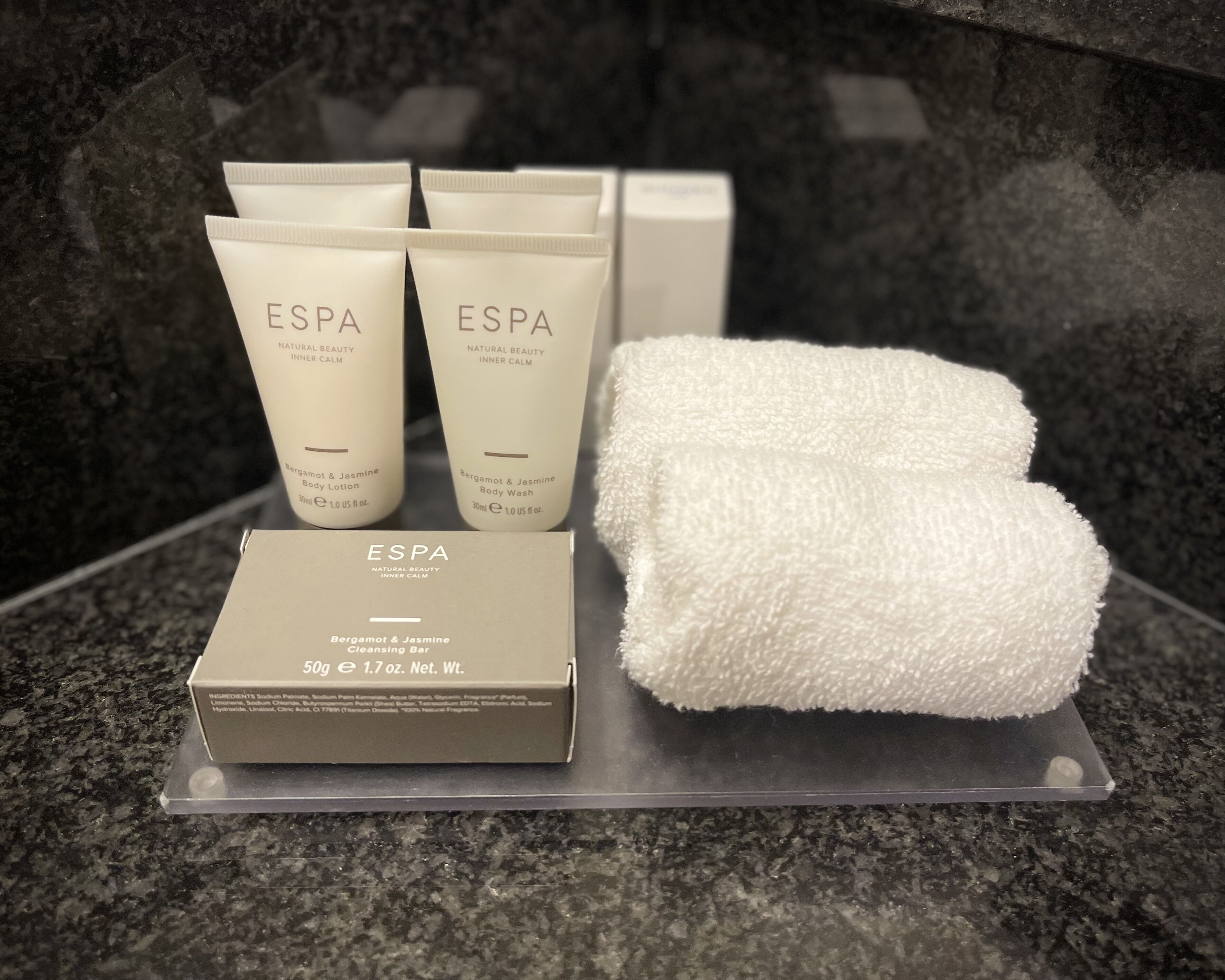 deluxe room | bathroom | combined shower/bathtub, designer toiletries, hair dryer, bathrobes