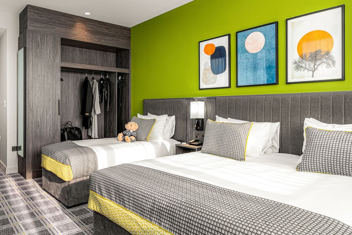 family room | 1 bedroom, premium bedding, in-room safe, desk