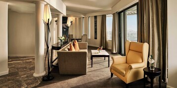 Studio Balcony Suite | Living area | Flat-screen TV