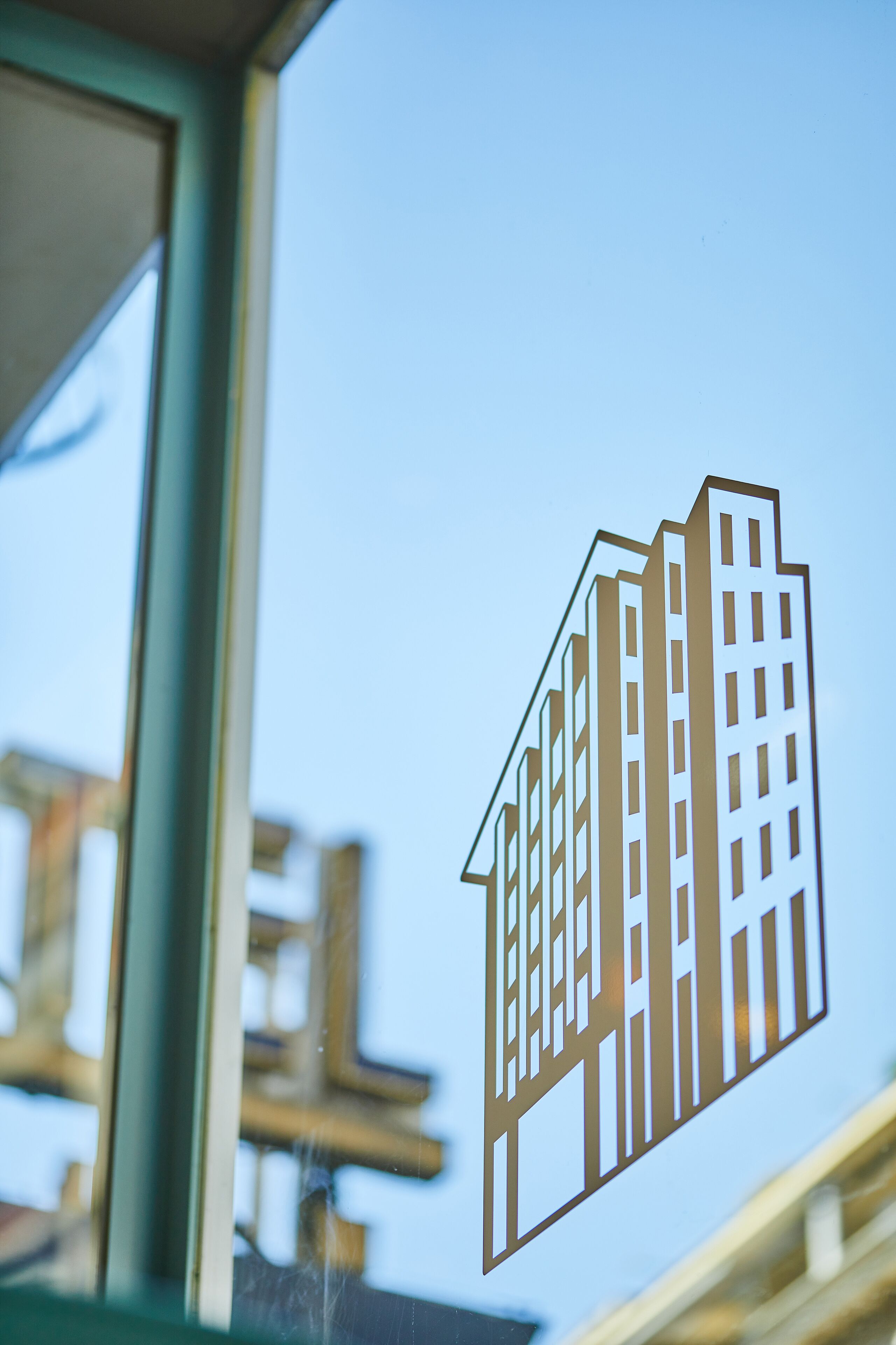 A building silhouette cut out of a window.