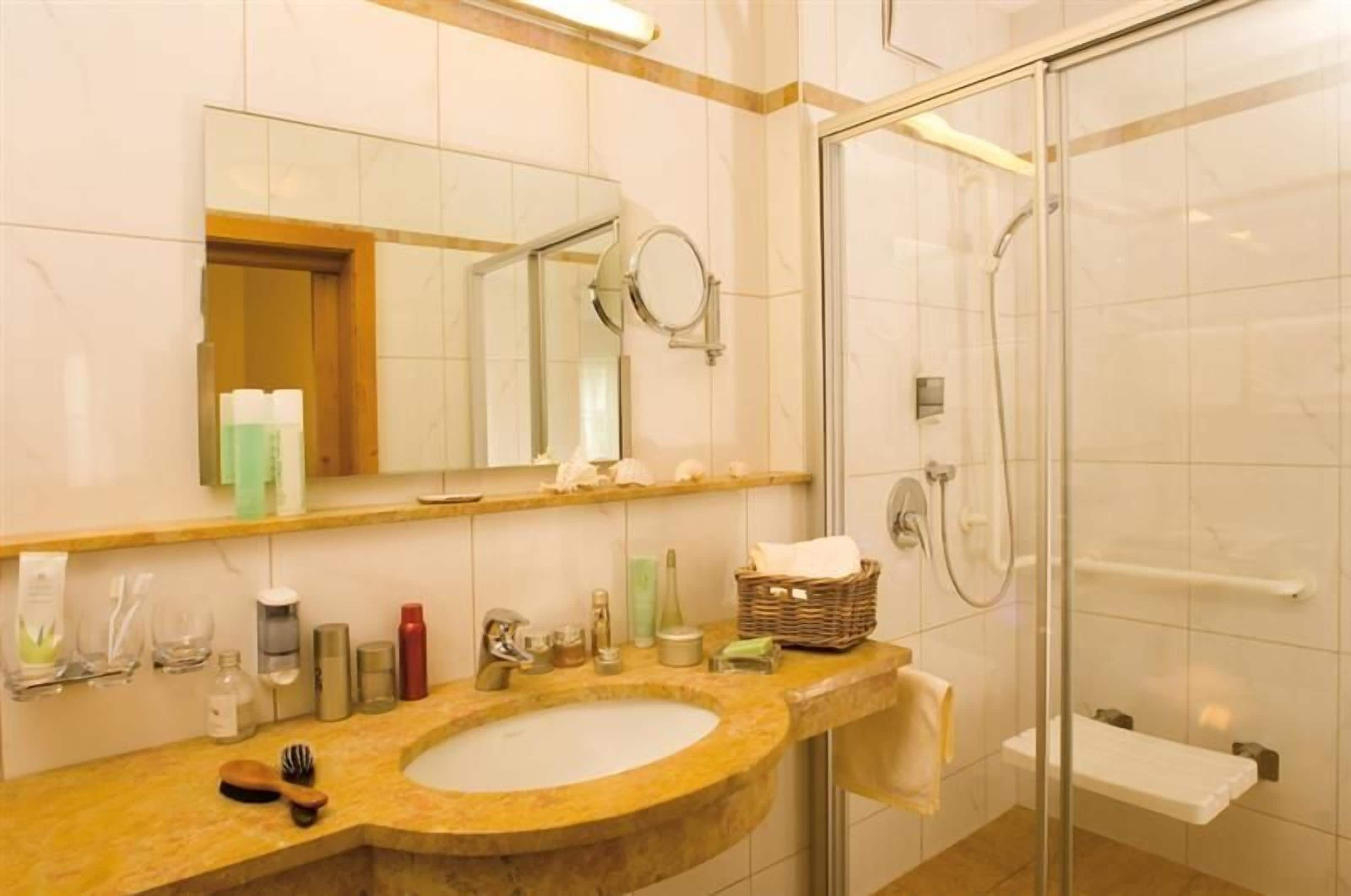 superior double room | bathroom | hair dryer, towels