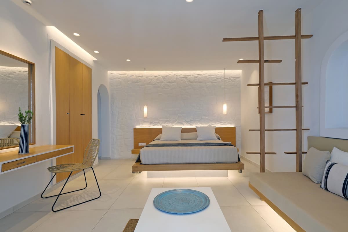 superior room, sea view | minibar, in-room safe, desk, iron/ironing board