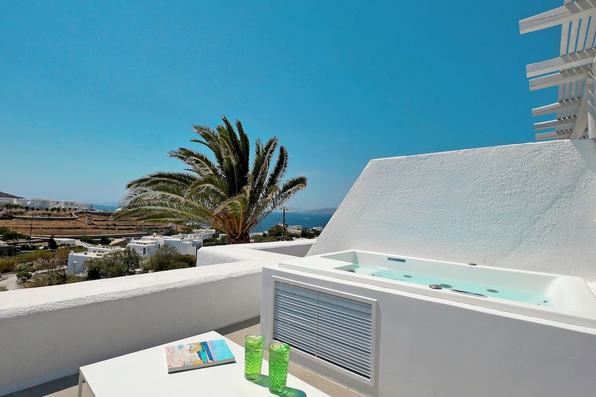 Junior suite, hot tub, uitzicht op zee | Bubbelbad
