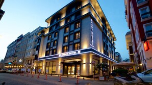 The Erboy Hotel with a modern facade, multiple floors, and a prominent entrance. - Erboy Hotel (Istanbul)