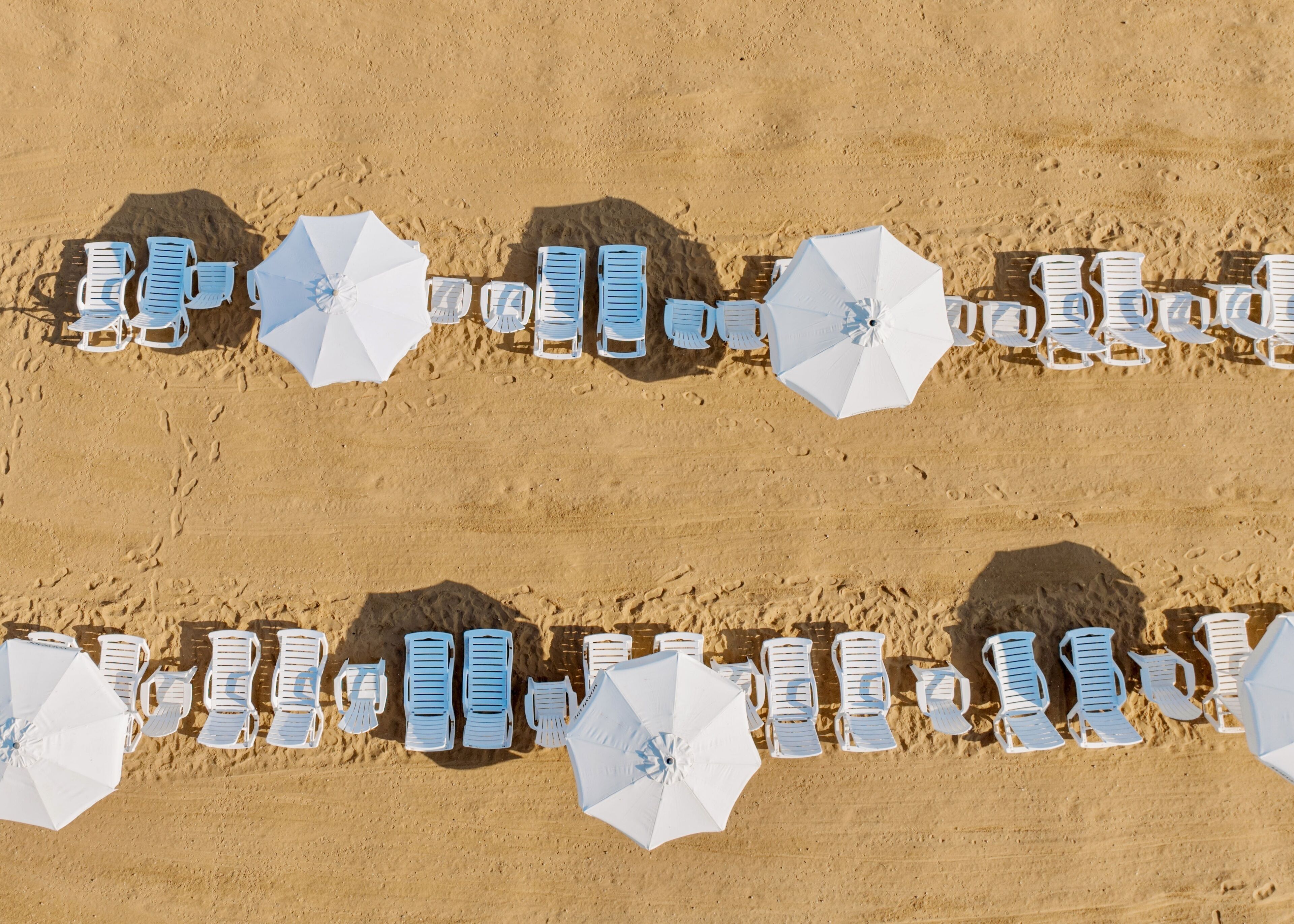 on the beach, sun-loungers, beach umbrellas, beach towels