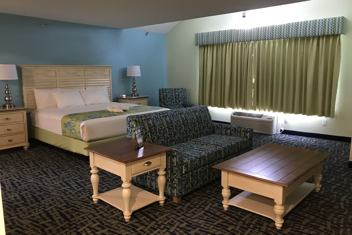 room, multiple beds (2 king beds, 2 bathrooms, no view) | in-room safe, desk, iron/ironing board, cots/infant beds