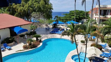 Outdoor pool, open 8:30 AM to 8:00 PM, pool umbrellas, pool loungers