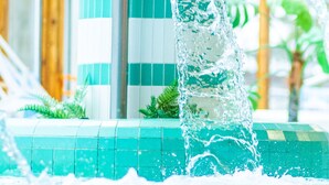 A water feature with a spout and a colorful decoration. - Spahotel Casino (Savonlinna)