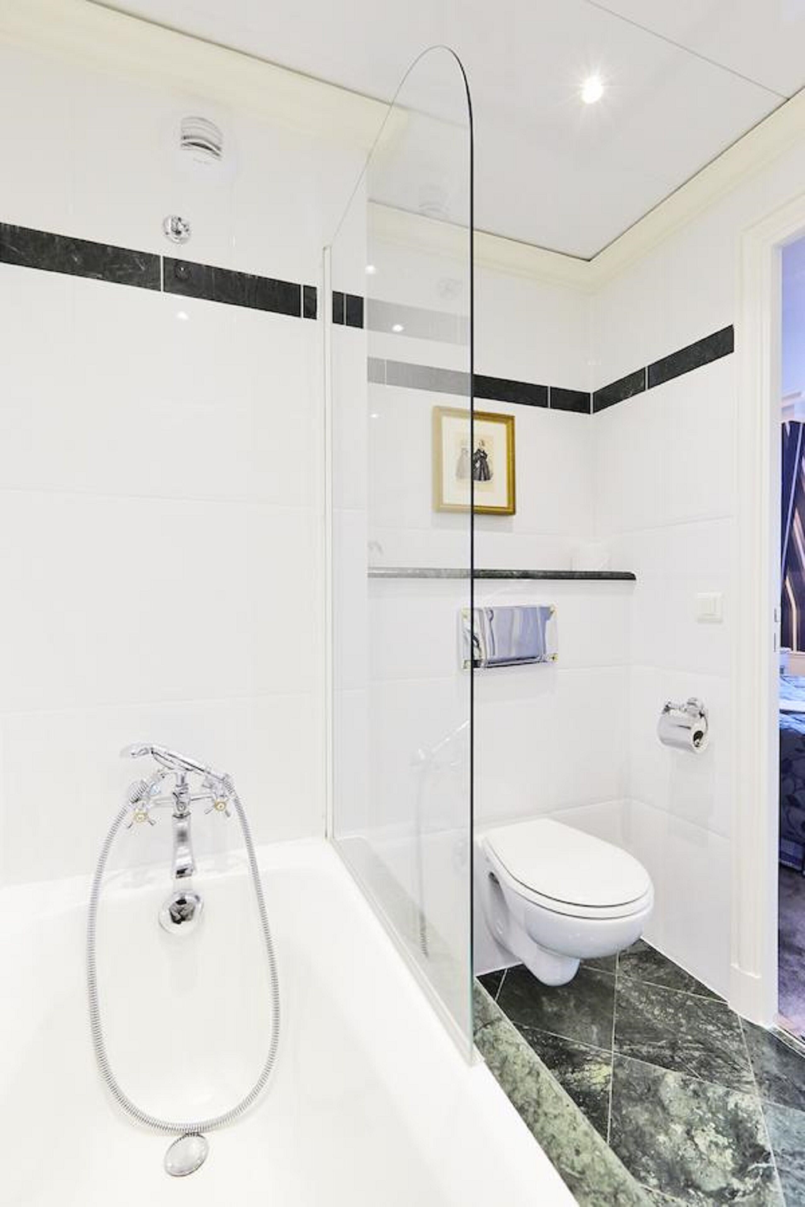 combined shower/bathtub, designer toiletries, hair dryer, towels