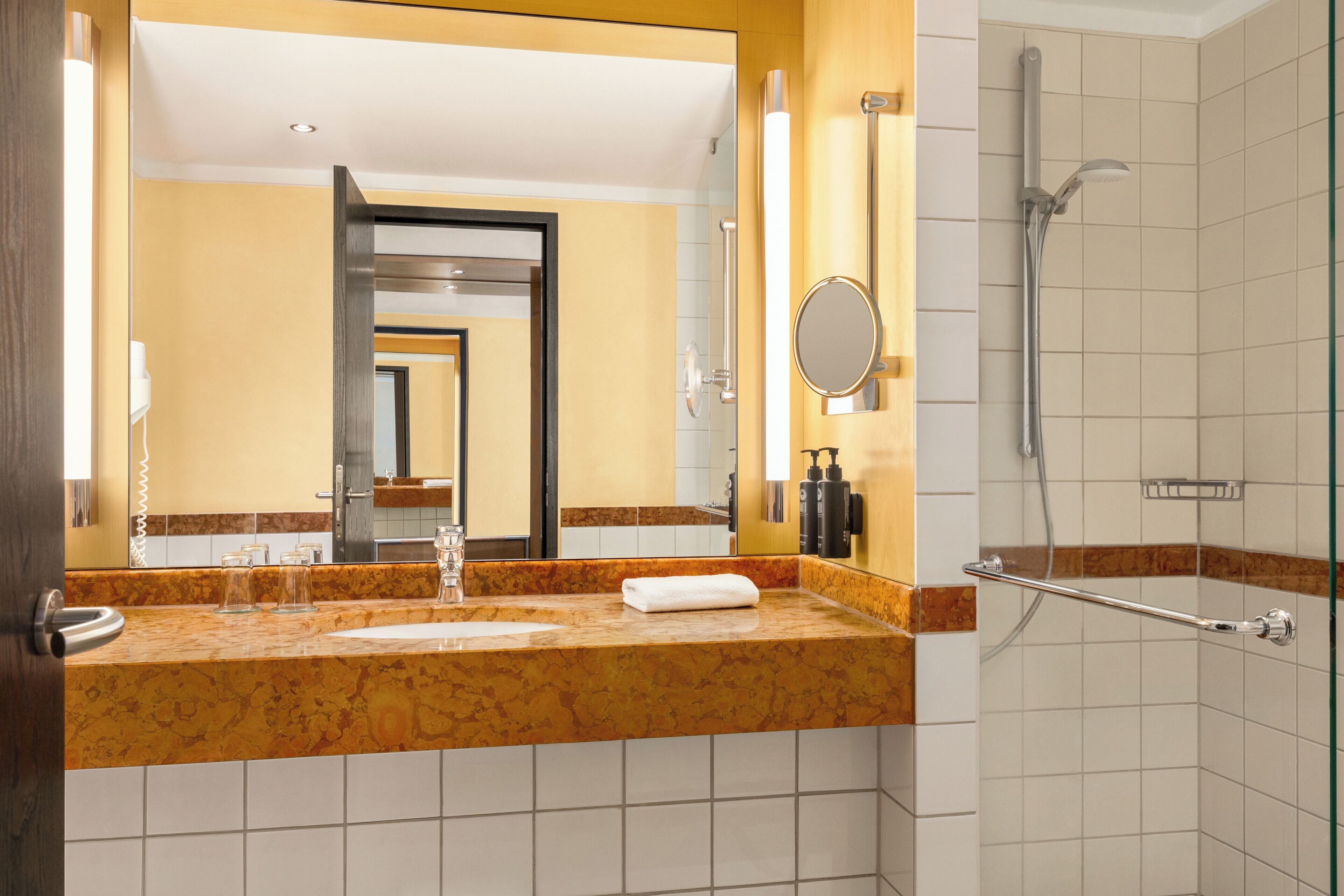 Eco-friendly toiletries, hair dryer, towels, toilet paper