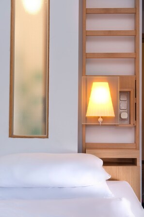 Hypo-allergenic bedding, down duvets, in-room safe, desk