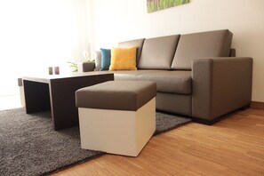 Deluxe Apartment | Living area | TV
