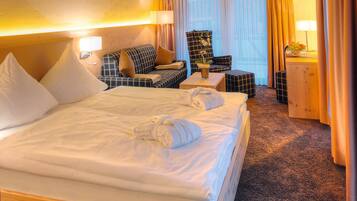 Luxe beddengoed, een minibar, een kluis op de kamer, een bureau