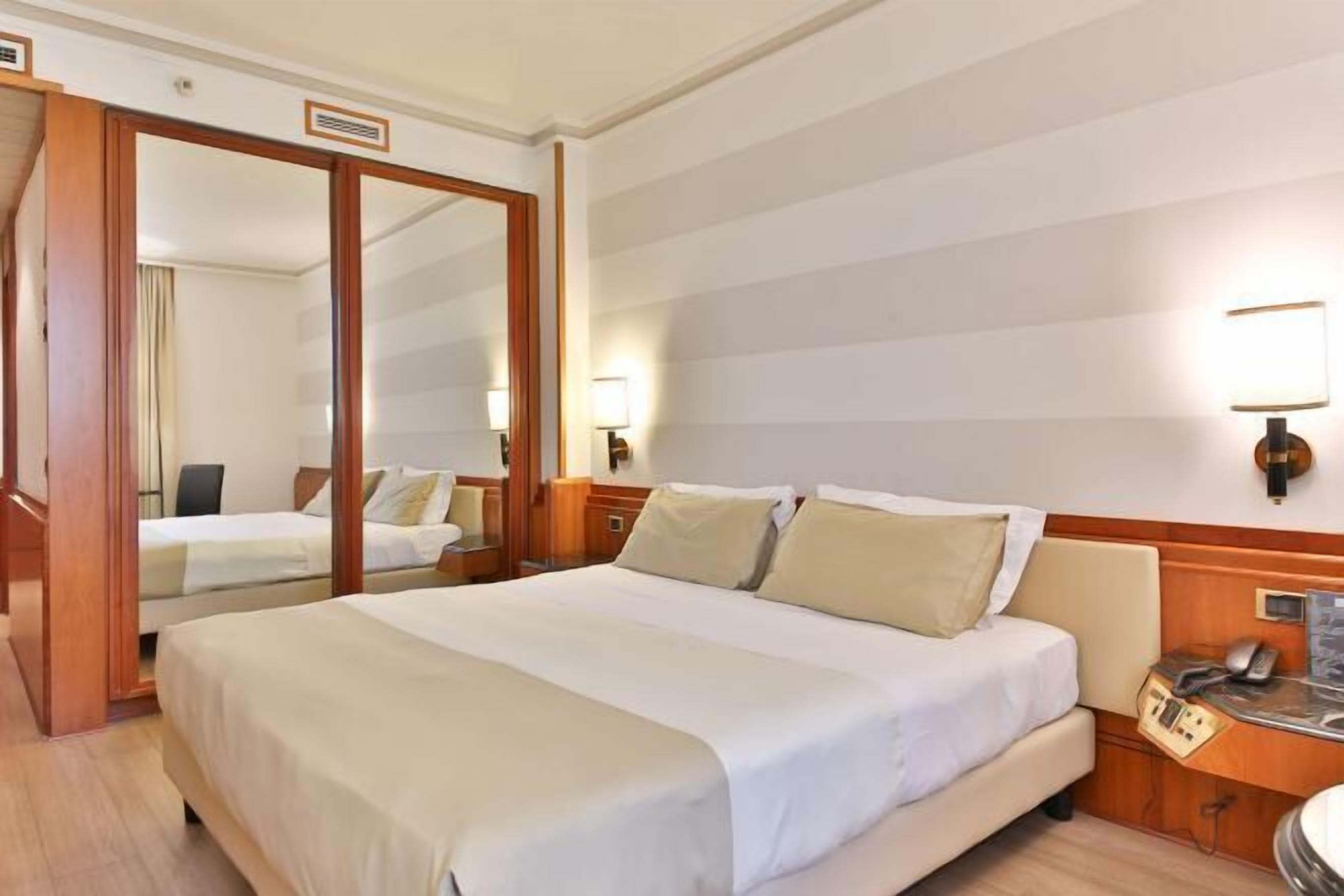 Down comforters, memory foam beds, minibar, in-room safe