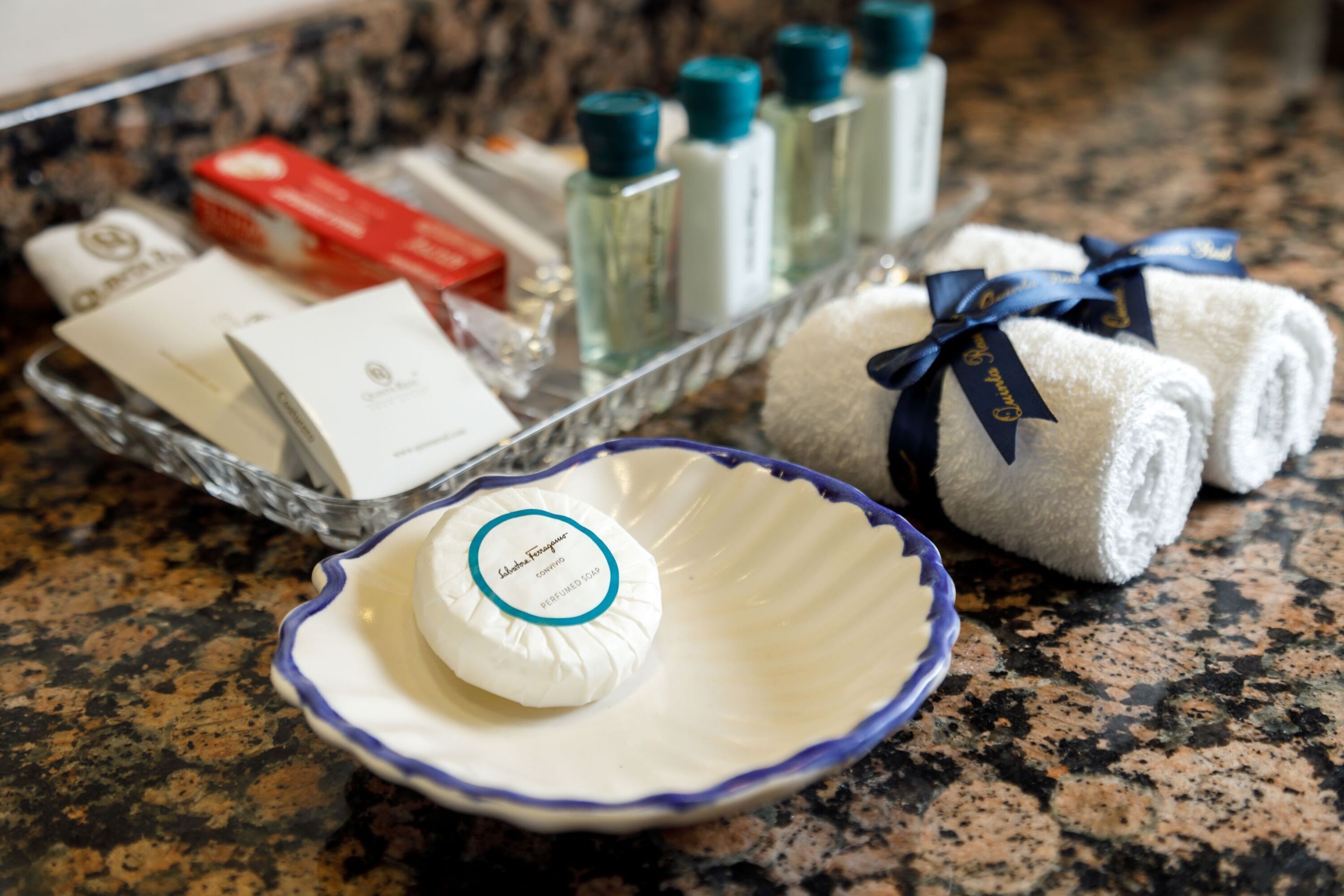 designer toiletries, hair dryer, bathrobes, slippers