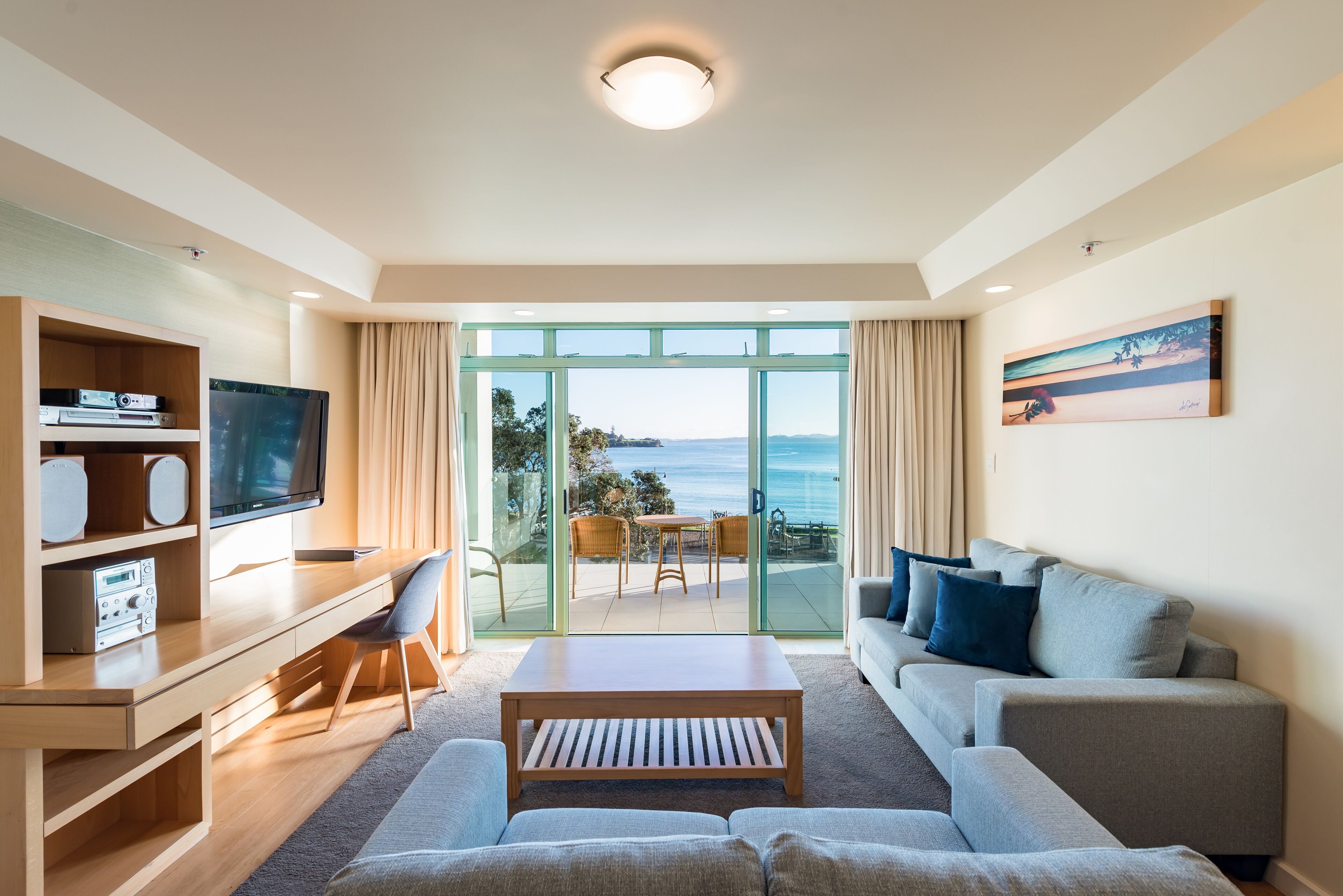 superior suite, ocean view (third floor) | living area | 55-inch flat-screen tv with satellite channels, tv, dvd player