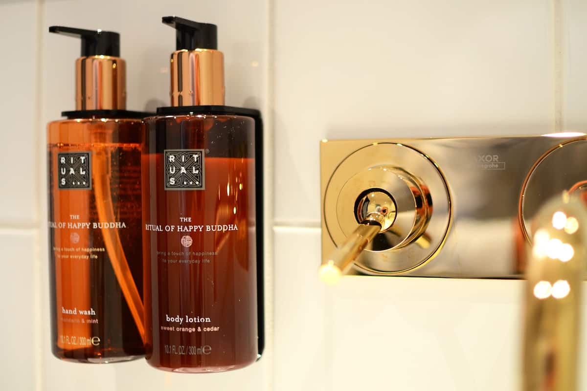 shower, designer toiletries, hair dryer, towels