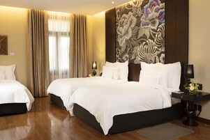 Premium bedding, down comforters, minibar, in-room safe