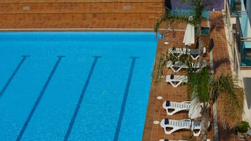 Seasonal outdoor pool, pool umbrellas, pool loungers