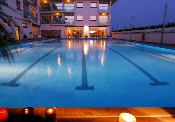 Seasonal outdoor pool, pool umbrellas, pool loungers