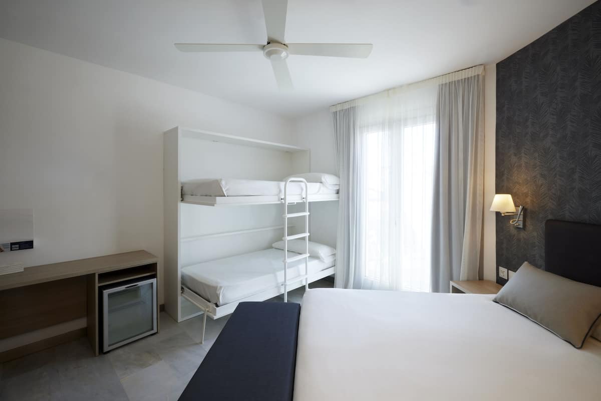 Family Room | 1 bedroom, minibar, in-room safe, individually furnished