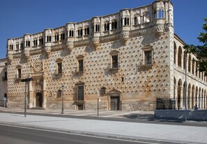 Stunning historic building with a unique geometric facade, blending traditional and modern influences.
