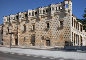 Stunning historic building with a unique geometric facade, blending traditional and modern influences.