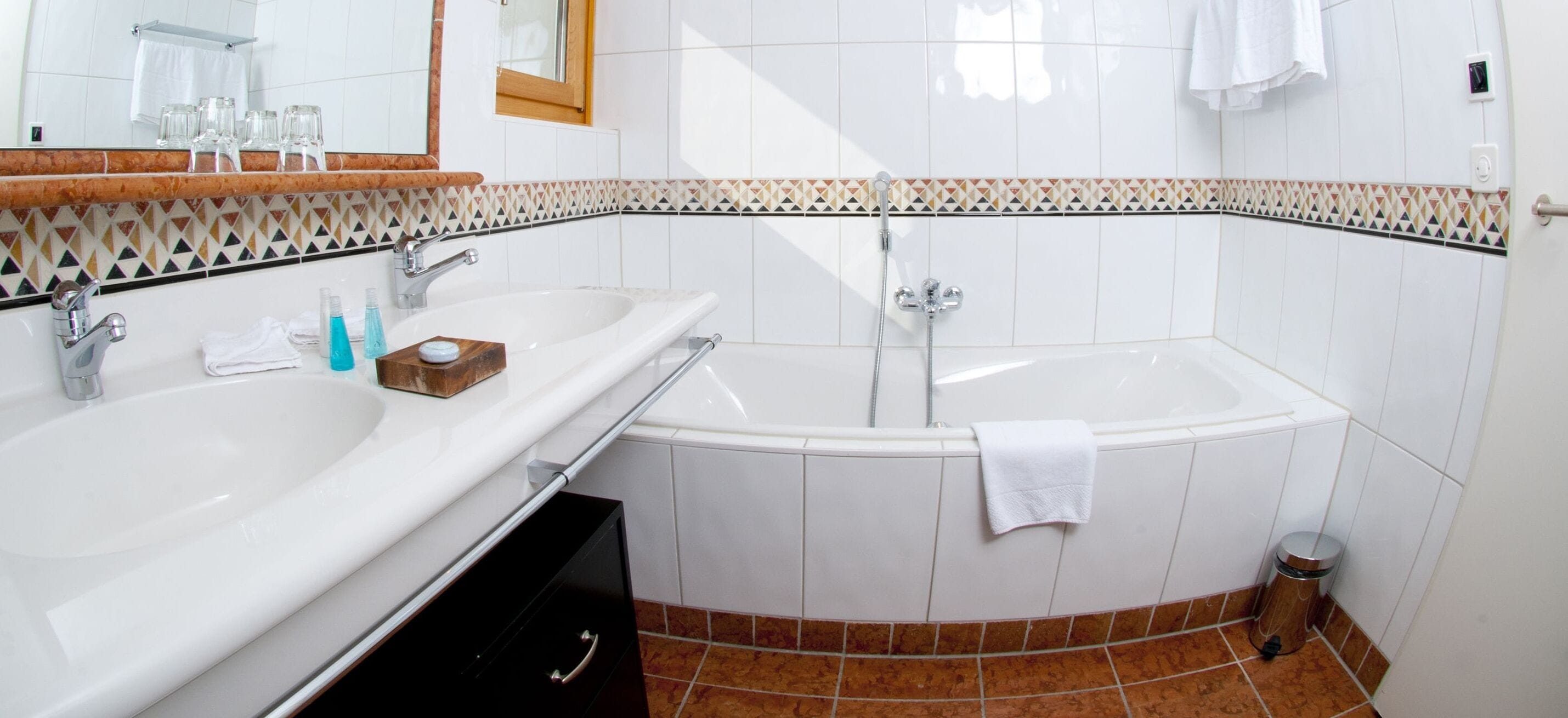 combined shower/bathtub, free toiletries, hair dryer, bathrobes