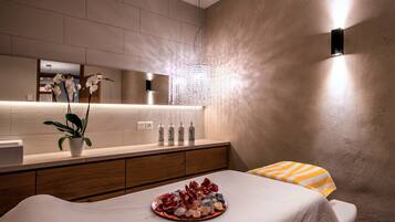 Relax in a serene space with a comfortable bed, a potted plant, and a stylish cabinet.