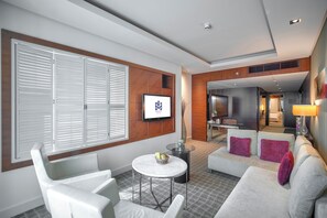 Presidential Suite | Living area | 32-inch LCD TV with cable channels, TV, iPod dock