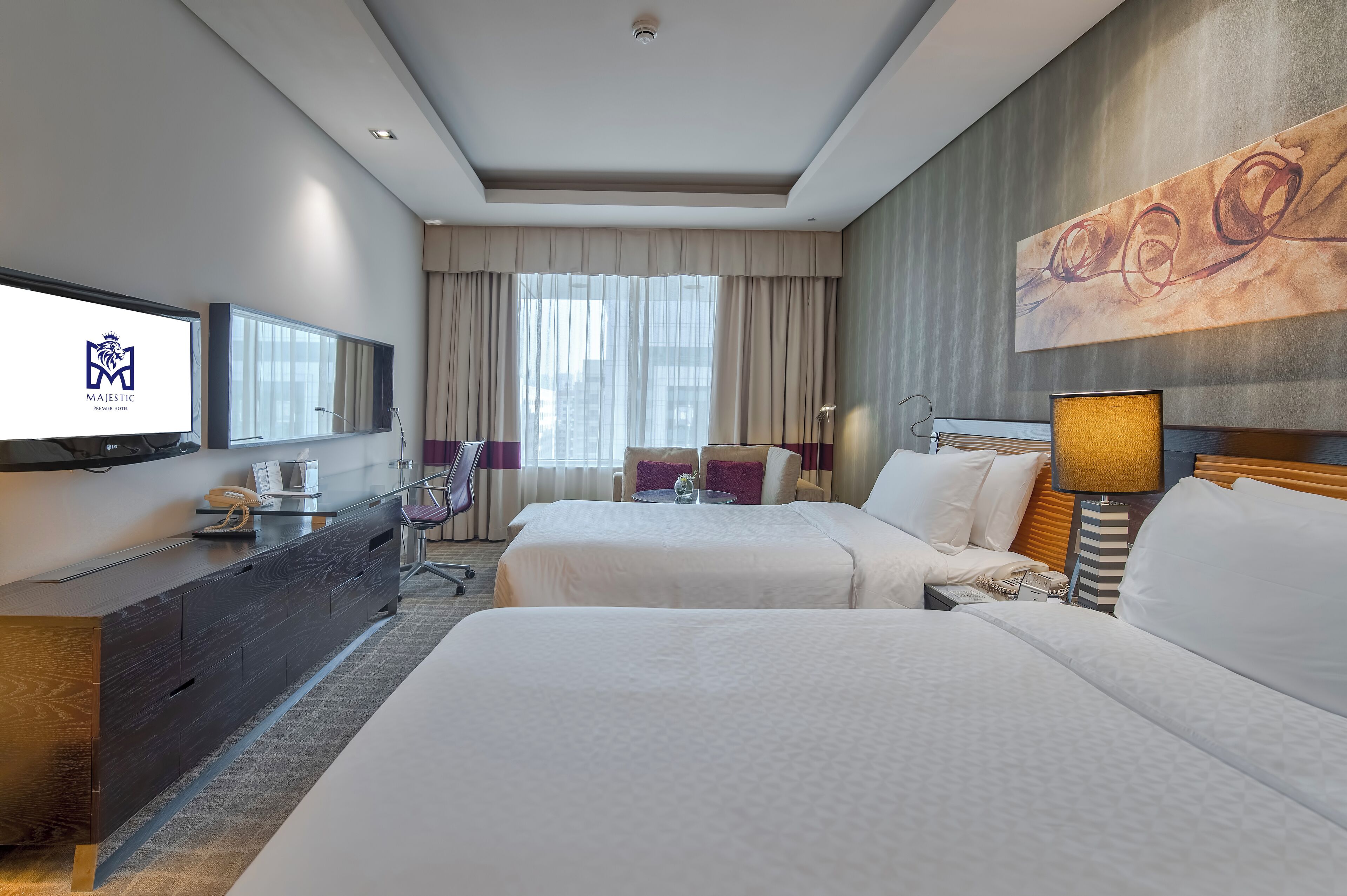 deluxe room | premium bedding, minibar, in-room safe, desk